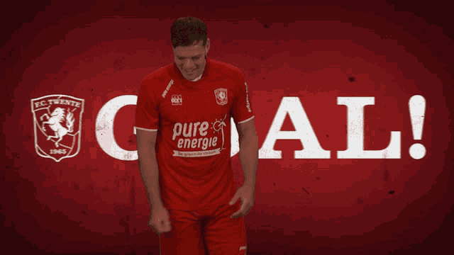 a man in a red shirt with pure energie on it