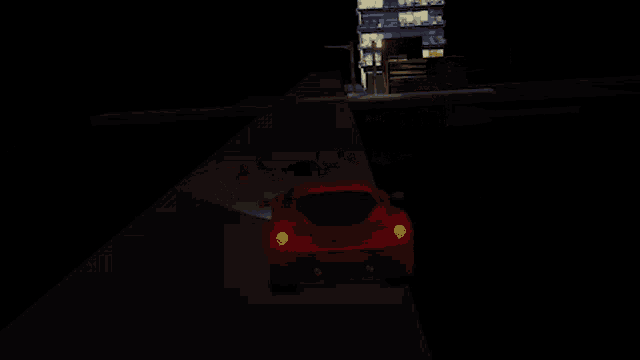 a red car is parked in front of a building that has been destroyed