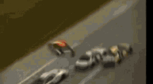 a man is driving a race car with a helmet on