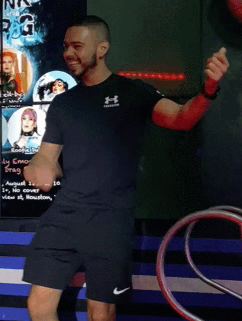 a man in a black under armour shirt