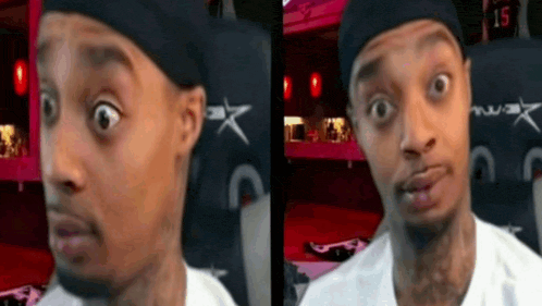 a man is making a funny face in front of a sign that says " 15 "