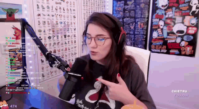a woman wearing glasses and headphones is talking into a microphone on a twitch channel called chiefru