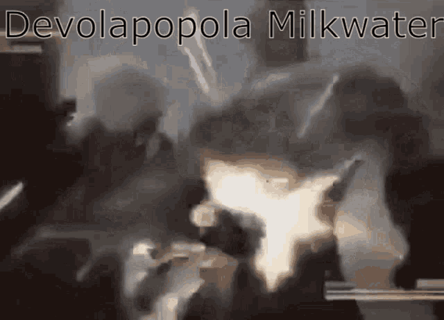 a blurred image of a group of people with the words devolapopola milkwater on the bottom