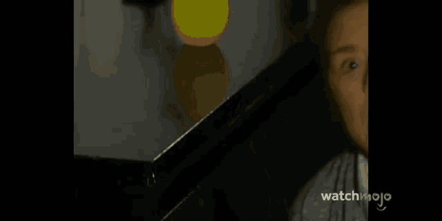 a close up of a woman 's face with the words watchmojo on the bottom left