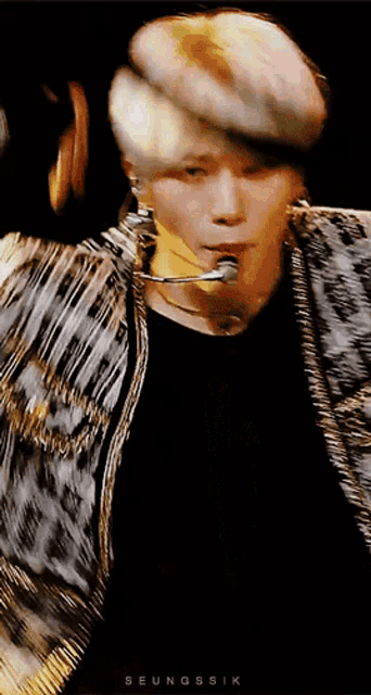 a close up of a person 's face with the name seungsik on the bottom left
