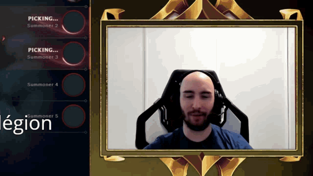 a man is sitting in front of a screen that says picking summoner 2 on it