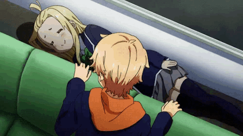 a boy and a girl are laying on a green couch in an anime scene .