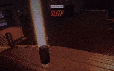 a can of soda sits on a staircase in front of a contested sleep sign