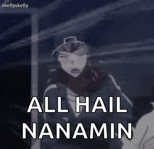 a cartoon character is standing in front of a door and says all hail nanamin .