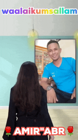 a woman is looking at a picture of a man in a blue shirt with the words waalaikumsalam above her