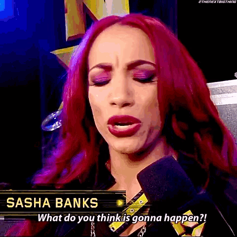 a woman with red hair is talking into a microphone and says sasha banks what do you think is gonna happen ?