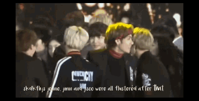 a group of people standing next to each other with one wearing a givenchy shirt