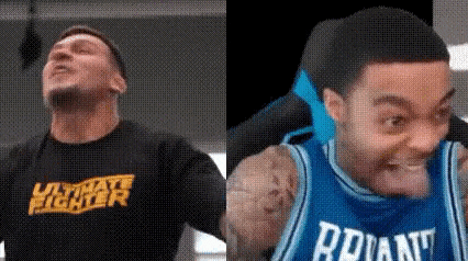 a man in a black shirt and a man in a blue jersey are making funny faces .