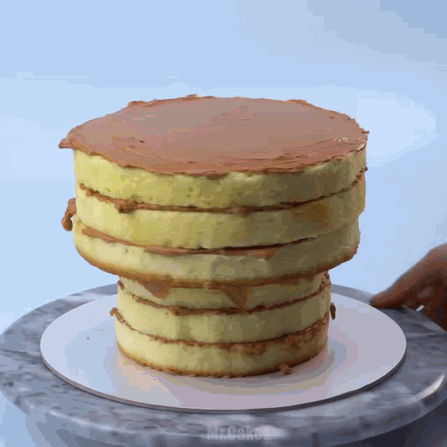 a cake stacked on top of each other with the word mr.cakes visible