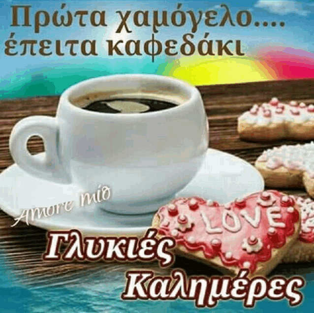 a cup of coffee on a saucer next to a heart shaped cookie with the word love on it .