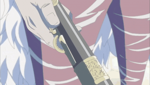 a close up of a person holding a sword with a ring on it