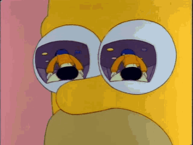 homer simpson is sitting in a chair with his head in his hands and his eyes are open .