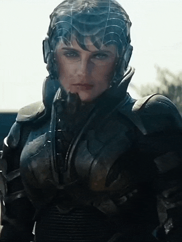 a close up of a woman wearing armor and headphones