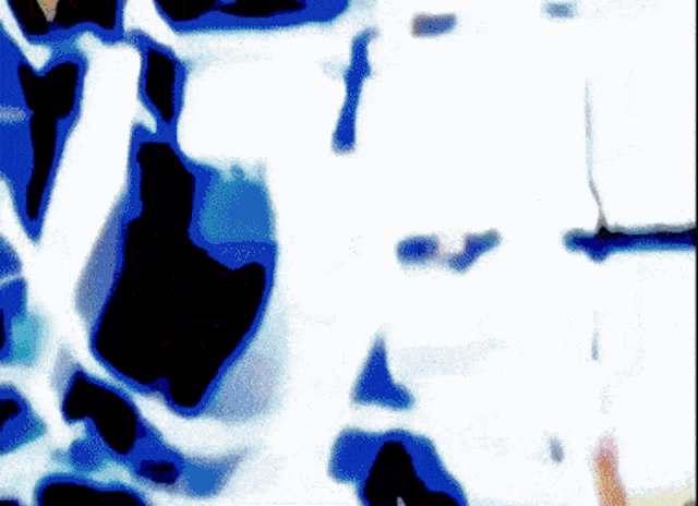 a blurry picture of a blue and white colored background
