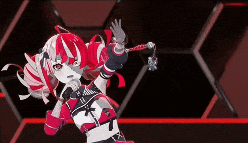 a girl with red hair is singing into a microphone while holding a cat keychain .
