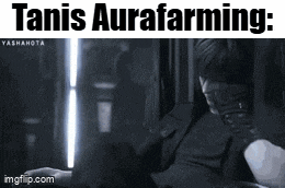 a black and white photo of a man with the words " tanis aurafarming " on the bottom