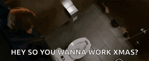 a man is sitting on a toilet in a bathroom with the words hey so you wanna work xmas written on the bottom .