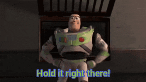 buzz lightyear from toy story is holding his hands on his hips and says hold it right there