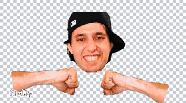 a man wearing a hat is making a fist with his hands