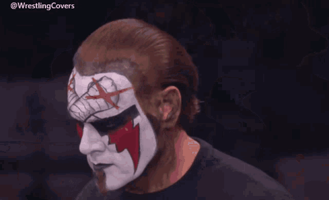 a close up of a wrestler 's face with the hashtag wrestlingcovers on the bottom
