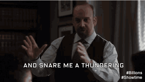 a man in a suit and tie is saying and snare me a thundering