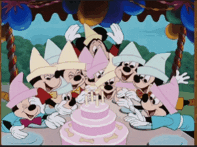 a group of mickey mouse characters are gathered around a pink cake