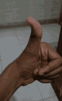 a person is giving a thumbs up sign with their fingers