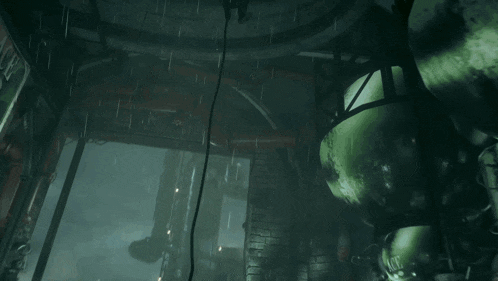 a man in a blue helmet is holding a sword in a dark room