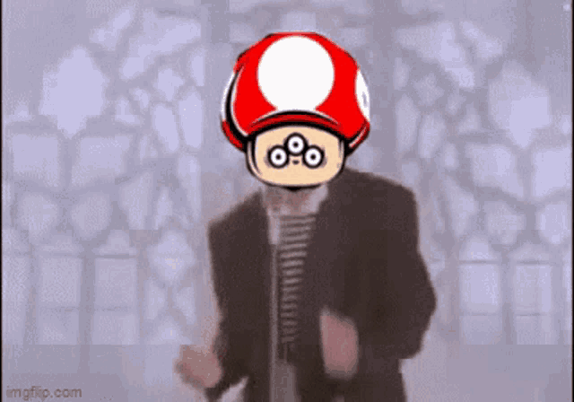 a man in a suit with a red mushroom on his head