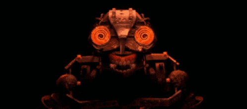 a close up of a robot 's face with red eyes