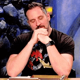 a man in a black shirt with a dragon on it