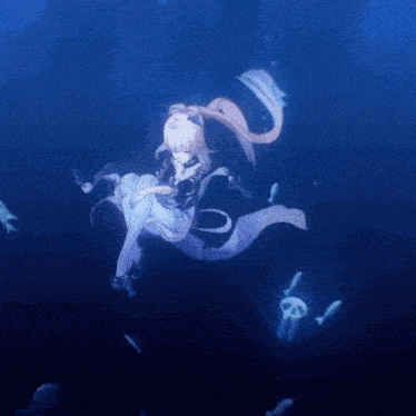 a girl is swimming in the ocean with fish and jellyfish around her