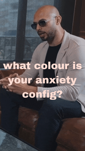 a man wearing sunglasses sits on a couch with the words what colour is your anxiety config below him