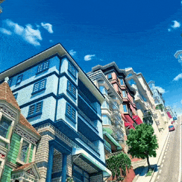 a row of buildings on a hillside with a blue sky