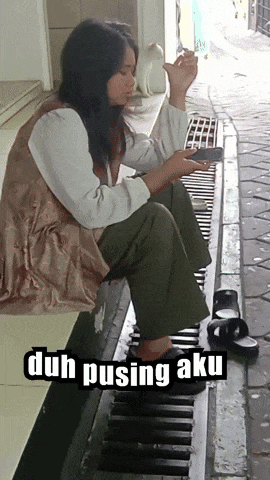 a woman sitting on a drain with the words duh pusing aku written on the bottom