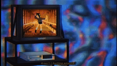 a tamari television is on a stand next to a vcr