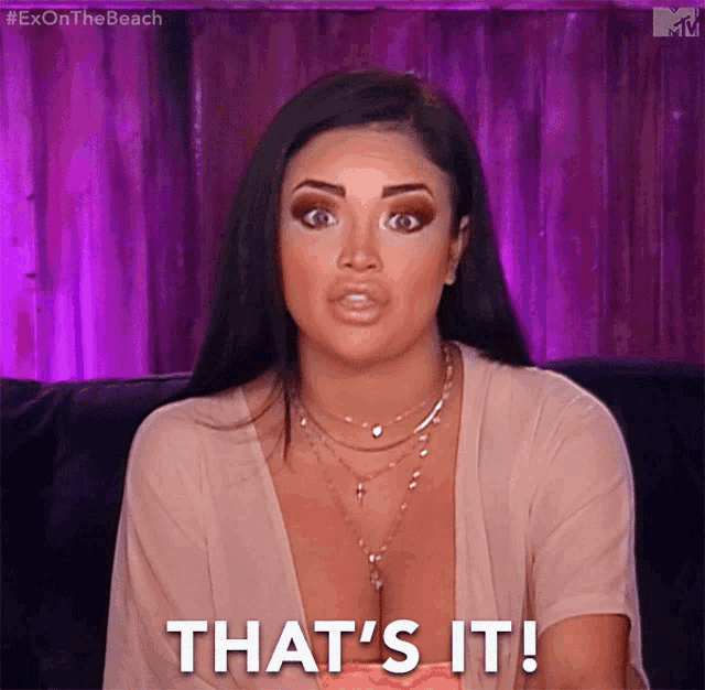 a woman sitting on a couch with the words that 's it on her face