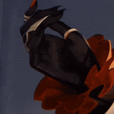 a close up of a person 's hand with a black glove