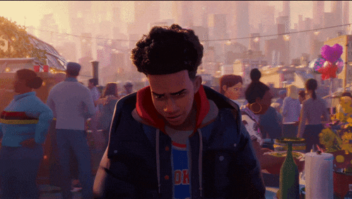 a man wearing a shirt that says 01 stands in a crowded area