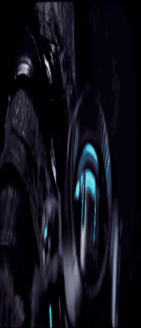 a blurred image of a person 's face with a blue light behind them
