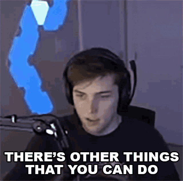 a young man wearing headphones is sitting in front of a microphone and saying there are other things that you can do .