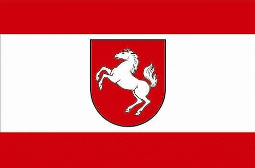 a red and white flag with a white horse on a red shield .
