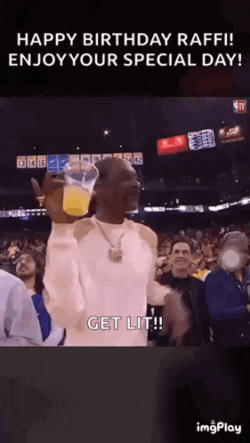 snoop dogg is holding a glass of orange juice in front of a crowd of people .