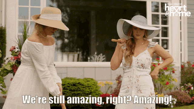 two women standing in front of a house with the words " we 're still amazing right ? amazing "