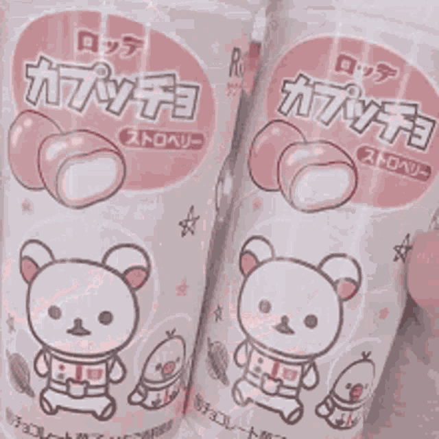 a close up of a pink drink with heart shaped ice cubes in it .